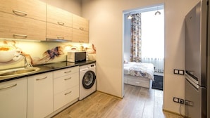 Apartment (Galitskaya St. 19v) | Private kitchen | Fridge, microwave, stovetop, electric kettle - Apart-hotel on sqr. Market (Lviv)
