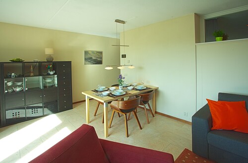 Modern apartment with a view of the dunes 350m to the North Sea WiFi parking