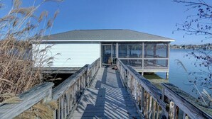 A wooden dock leading to a house with a glass enclosure, overlooking a calm body of water. - Main house & guest cottage on over 400 feet of waterfront on the public side (Mineral)
