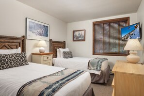 A hotel room with two beds, a television, and a window with blinds. - Terracehouse ~ Ski-in/ski-out Retreat with Hot Tub + Fireplace, Walk to Village (Snowmass Village)