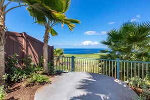 Enjoy breathtaking ocean views from this beachfront property, surrounded by lush greenery and a tranquil atmosphere.