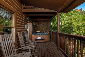 A wooden deck with a hot tub, wooden chairs, and a wooden fence. - 🏔️ Heaven's Garden🌲Mt LeConte Views, HotTub, near Dollywood (Sevierville)