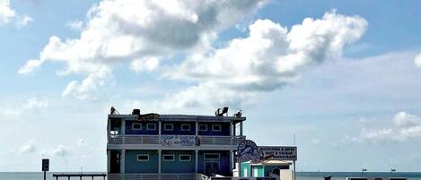 A pier with a restaurant and souvenir shop.