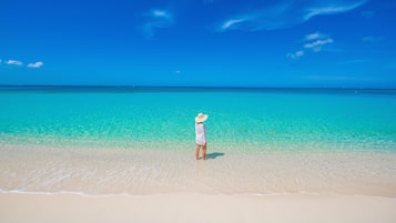 On the beach, sun-loungers, beach umbrellas, beach towels