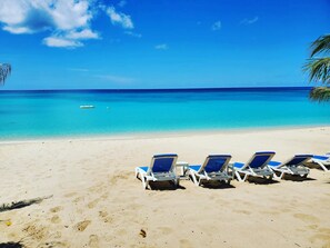 On the beach, sun-loungers, beach umbrellas, beach towels - 7 Mile Beach Private Beach Club. Ocean views from Roof Terrace and Pool Pavilion (West Bay)