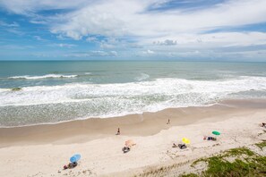 On the beach, sun loungers, beach towels