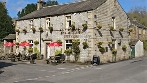 A stone building with a sign reading "The Victoria Free House." - The Victoria (Skipton)