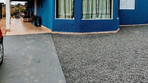 A blue house with a tiled roof and a gravel driveway. - Farm in Socorro wi-fi, solar heated pool, hot tub  (Socorro)