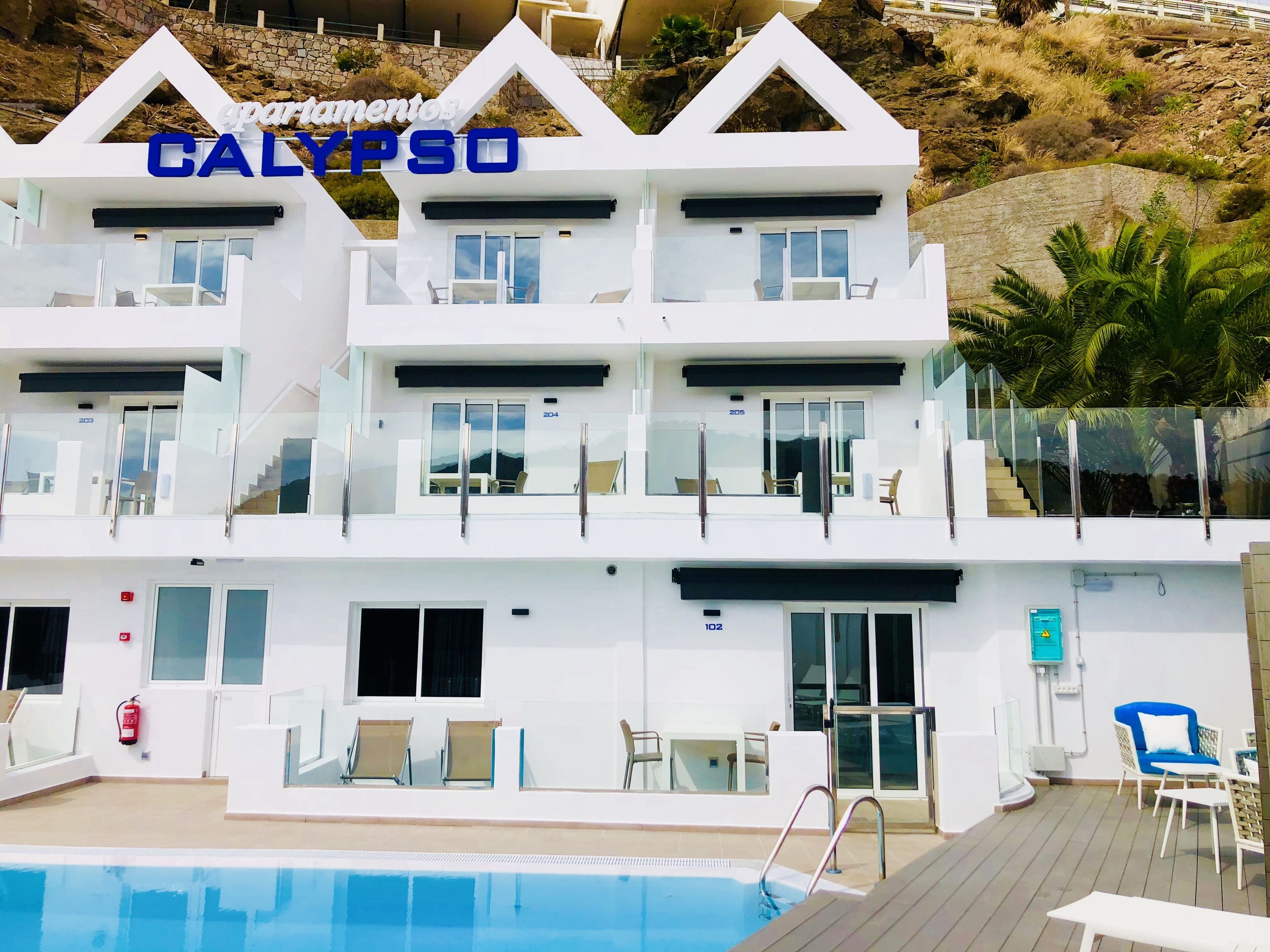 Contemporary apartment with private poolside terrace - sleeps up to three