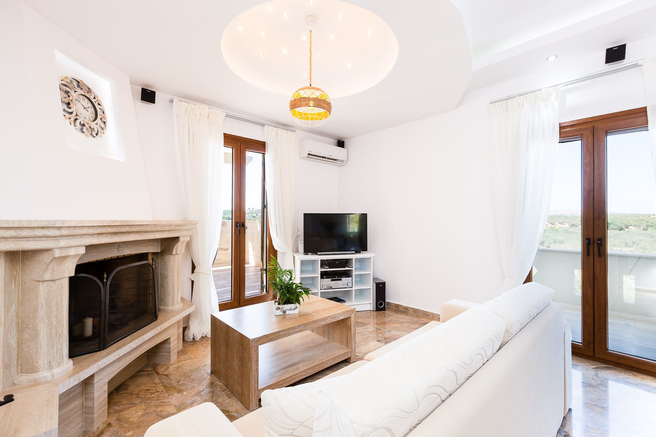 Flat-screen TV, fireplace, video-game console, DVD player