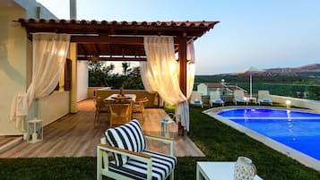 Outdoor pool, a heated pool, sun loungers