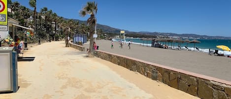 On the beach, sun-loungers, beach towels
