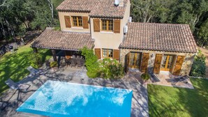 A two-story house with a swimming pool, outdoor furniture, and a well-maintained garden. - House A Sùvara ***** private pool, park with trees 15 hectares, 5 min PORTICCIO (Cauro)
