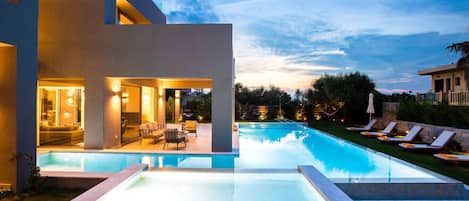 Outdoor pool, a heated pool, pool loungers