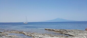 Brucoli Bay, relaxation with view on the gulf and the volcano Etna.