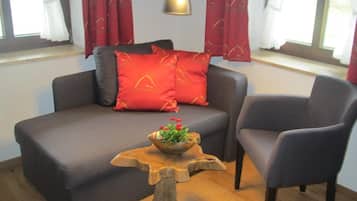 Family Room, Multiple Beds | Living area | Flat-screen TV