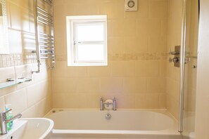 Combined shower/tub, hair dryer, towels, shampoo