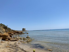 On the beach, sun loungers