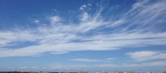 Chic apartment with sea views on a sandy beach, large roof terrace and WiFi