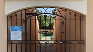 A gated entrance with a sign indicating restricted access. -  high standing *** villa with heated pool, near downtown (Porto-Vecchio)