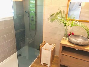 Shower, hair dryer, towels, toilet paper