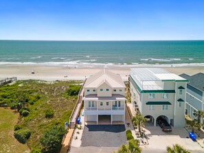 A beachfront property with a large house and a smaller building, both with direct ocean views. - 6 bed/6 baths, elevator, Oceanfront, private pool, linens & towels included!!! (Ocean Isle Beach)