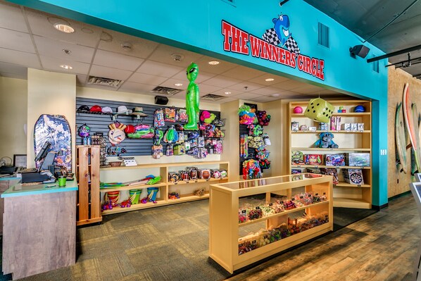 A store named "The Winner's Circle" with shelves of toys and games. - Oceanfront Suite w/Amazing View + Official On-Site Rental Privileges (North Myrtle Beach)