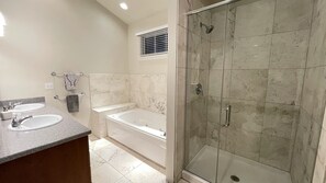 Shower, jetted tub, towels