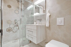 Shower, hair dryer, towels, soap