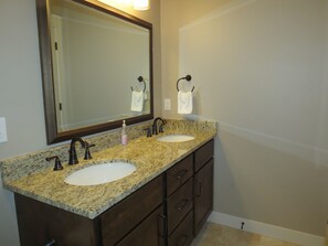 Combined shower/bathtub, hair dryer, towels, soap