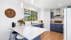 Fridge, stovetop, dishwasher, coffee/tea maker