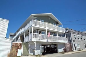 Situated on 12 G Street, this two-story building offers a spacious balcony on the upper floor.