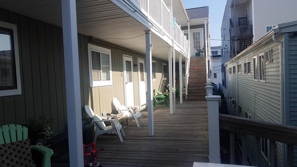 Enjoy the covered porch and outdoor living space with comfortable seating and a beautiful view.
