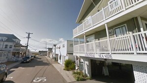 A street view of a coastal area with a building labeled "Colonial Sea Side." - Home Away From Home 2 (Hampton Beach)