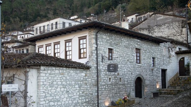 A stone building with a sign indicating it is a hotel. - Villa 4 Bed & Breakfast (Berat)
