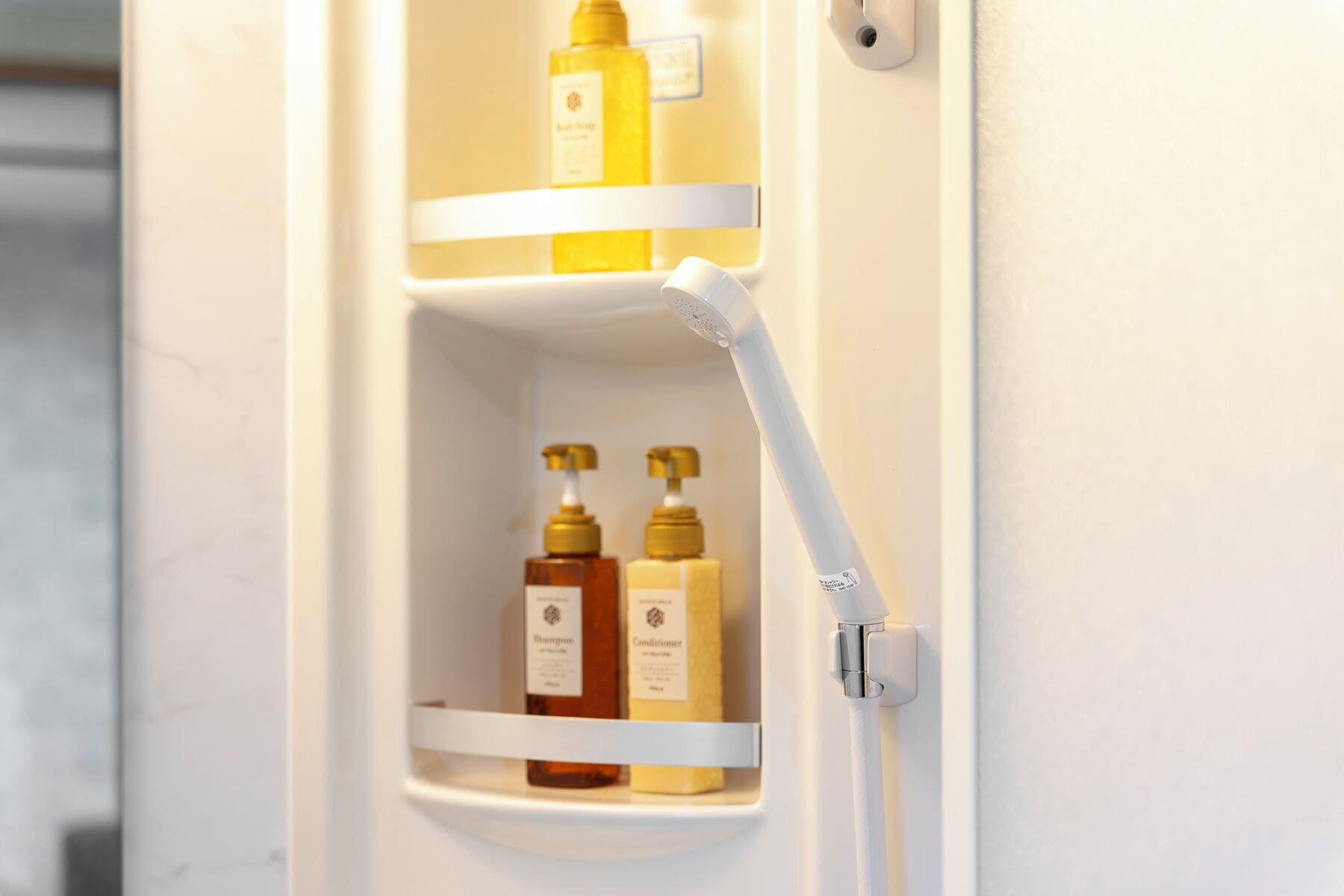 A bathroom shelf with toiletries.