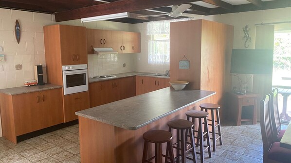 Microwave, oven, toaster, dining tables