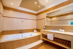 Combined shower/bathtub, hair dryer, towels, soap