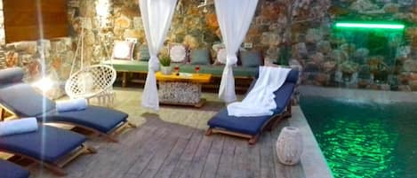 Outdoor pool, a heated pool, pool loungers