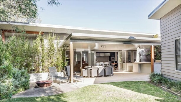 A modern house with a covered patio, outdoor seating, and a fire pit. - Mimosa—Stylish Beachside Retreat in Dunsborough (Dunsborough)