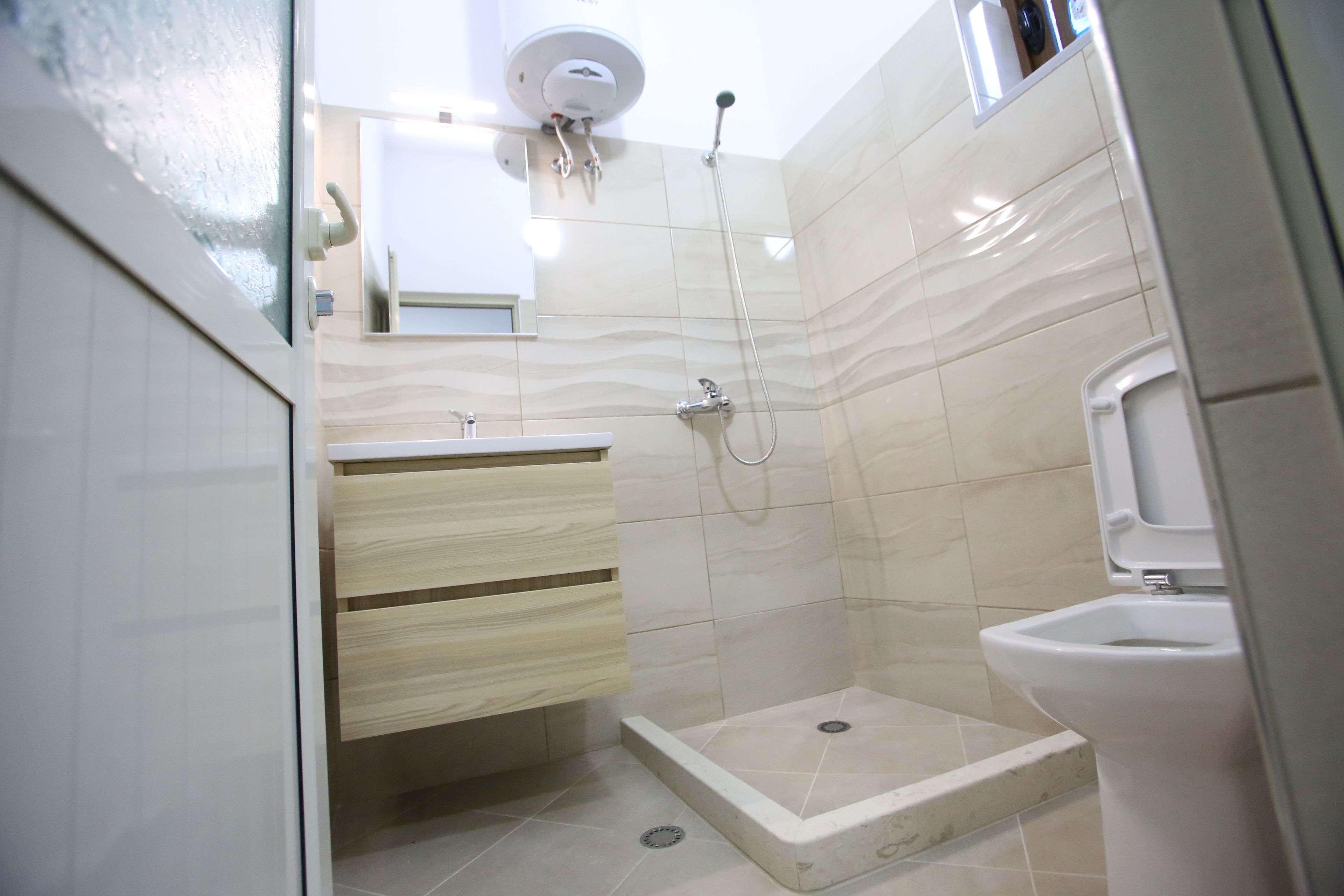 Apartment, 2 Bedrooms | Bathroom | Shower, hair dryer, bathrobes, slippers