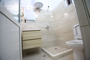 Apartment, 2 Bedrooms | Bathroom | Shower, hair dryer, bathrobes, slippers
