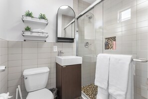Shower, hair dryer, towels, soap