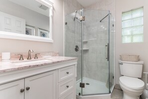 Shower, hair dryer, towels, soap