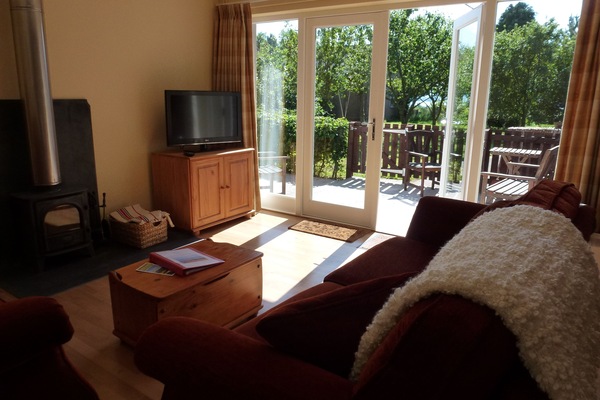 French doors leading to shared patio overlooking the orchard and farmland