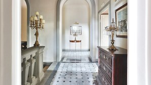 A hallway with a patterned floor, a grand staircase, and a chandelier. - Villa Franchetti - Luxurious Florentine Villa with Swimming Pool (Firenze)