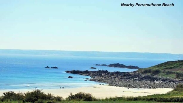 A coastal landscape with a sandy beach, rocky outcrops, and greenery. - Stunning coastal annex with spectacular sea views (Perranuthnoe)
