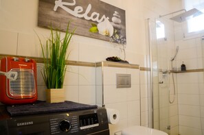 Shower, hair dryer, towels, soap