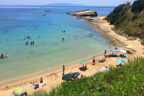 Sandy, cute Spartia beach: shallow, warm waters, few rocks around for snorkeling