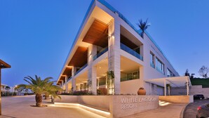 A modern building with a sign reading "White Lagoon Resort".